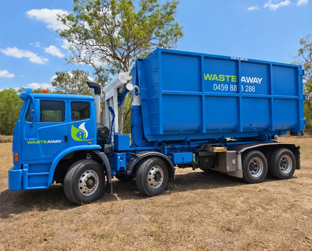 Blue NT Waste Away hook-lift truck carrying a hook bin
